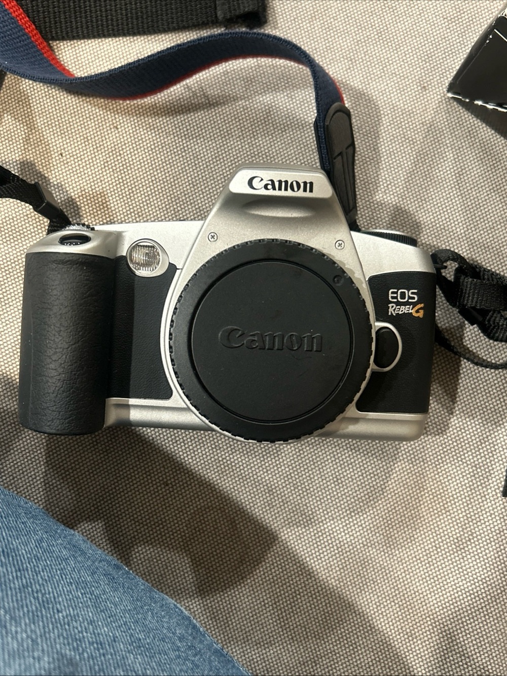 Canon EOS Rebel G Silver and Black Film SLR with Blue and Red Canon Strap - Picture 3 of 5